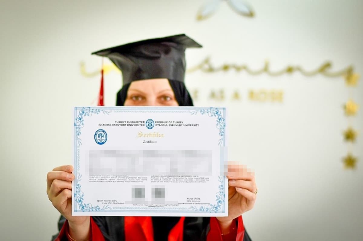 University-accredited diploma certificate (student details hidden)